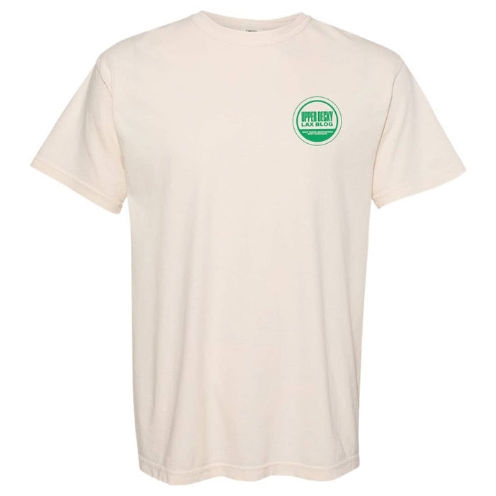 Front of ivory shirt with green circle in top left chest. inside green shirt says "Upper Decky Lax Blog. Best takes, Best brand, best rankings