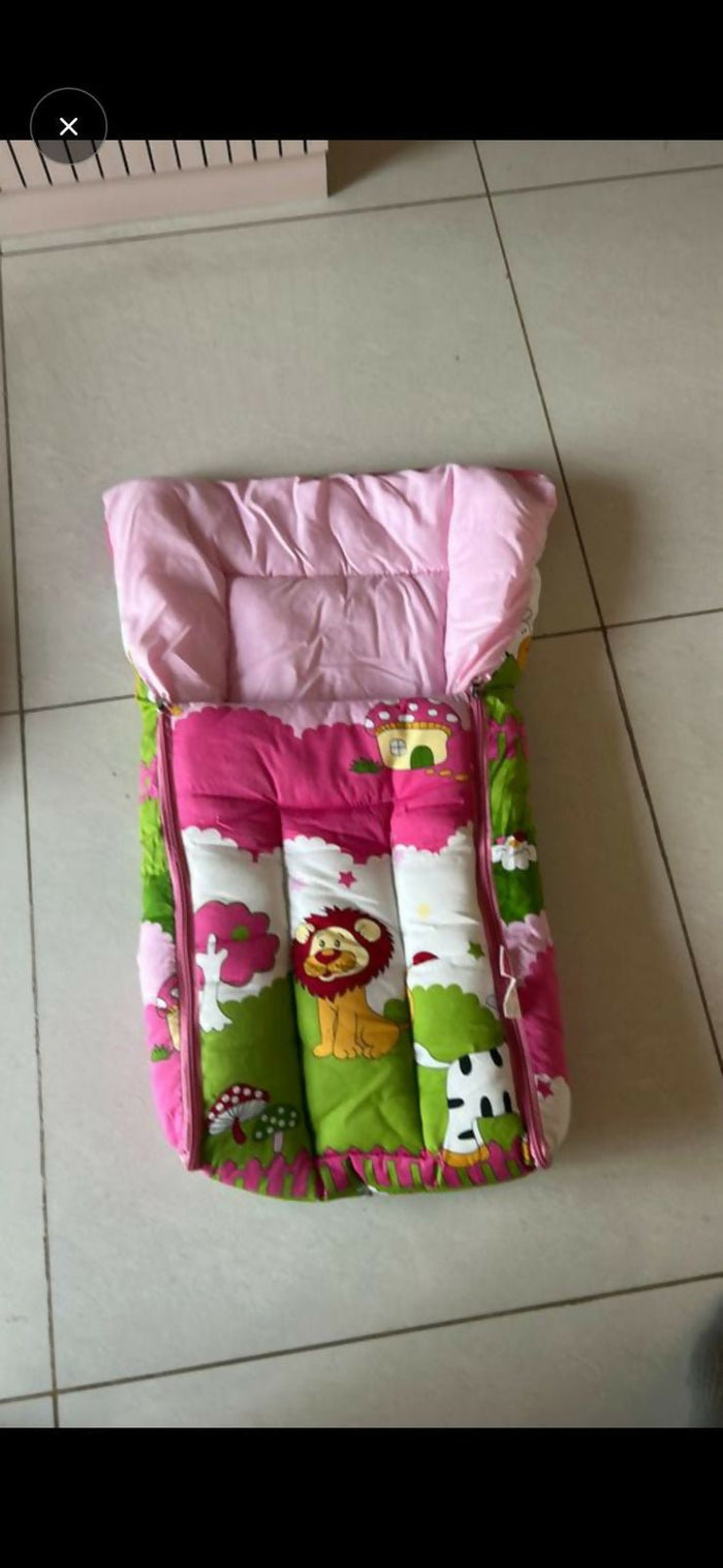 Children's seat with pink top and colorful bottom