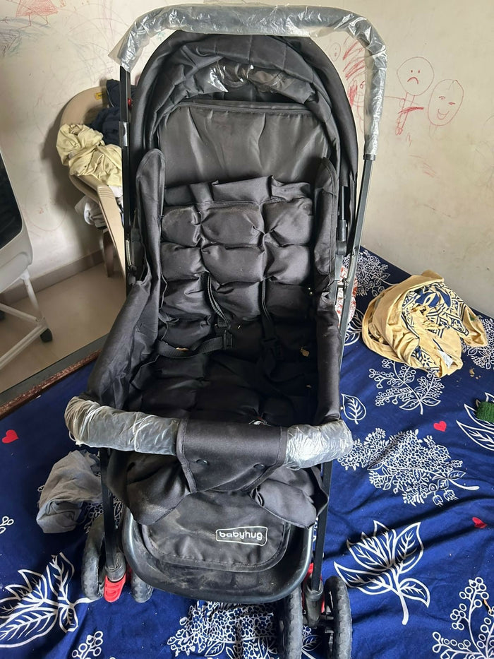 BABYHUG Cocoon stroller with mosquito net, reclining seat, safety harness, protective canopy, smooth wheels, and comfortable travel design for babies.