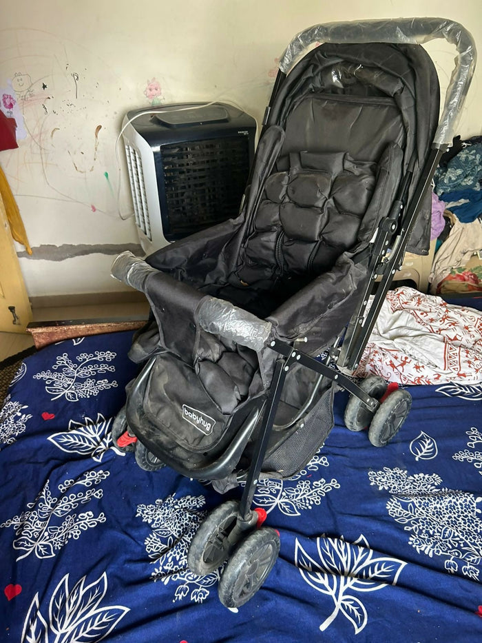 BABYHUG Cocoon stroller with mosquito net, reclining seat, safety harness, protective canopy, smooth wheels, and comfortable travel design for babies.