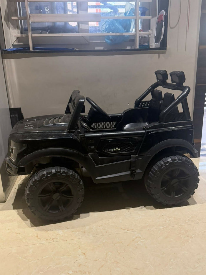 Battery Jeep for Kids with realistic design, rechargeable battery, working headlights, music, sturdy wheels, and easy controls for fun indoor and outdoor rides for young children.