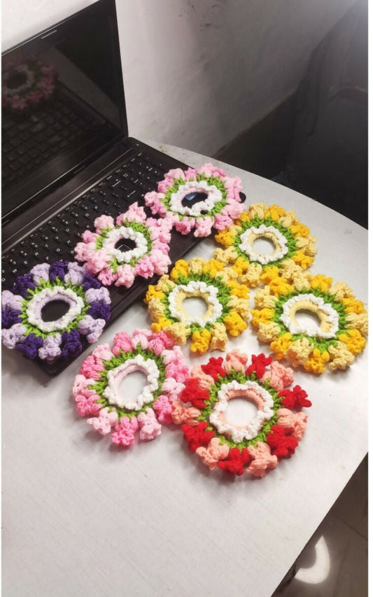 Colorful flower arrangements on a white surface with a black background