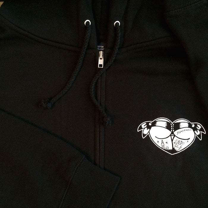 zipper close up on black mens hoodie with tattoo style butt heart logo.