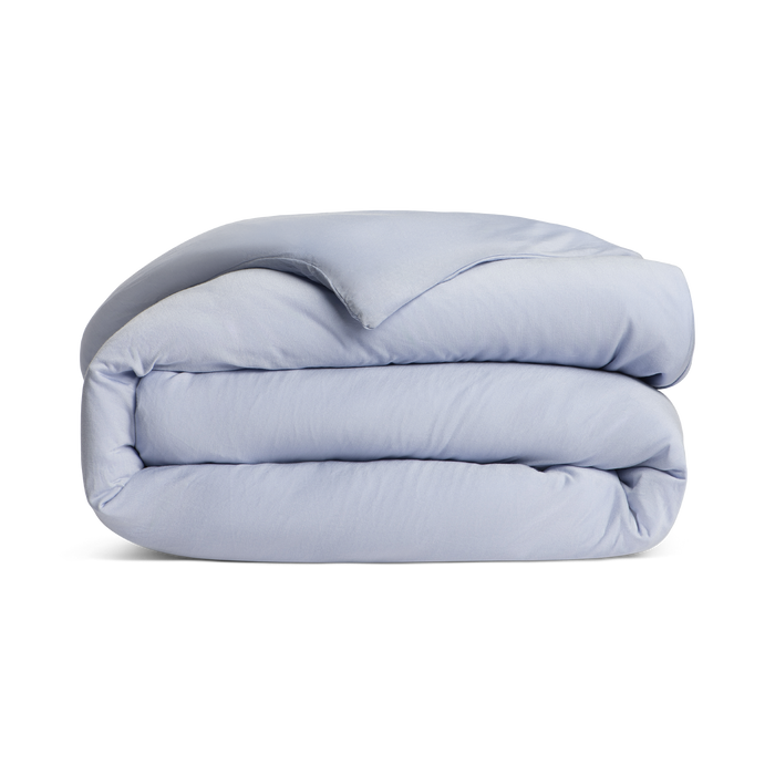 Folded light blue comforter png no background
