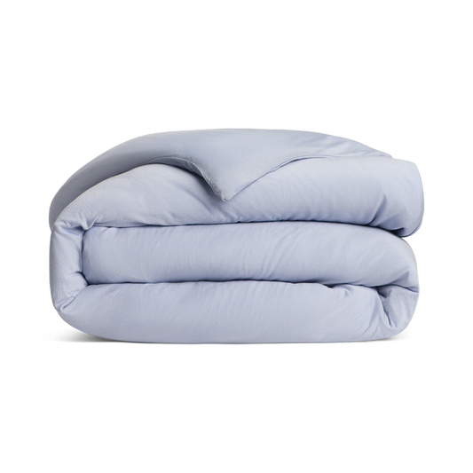Folded light blue comforter png no background