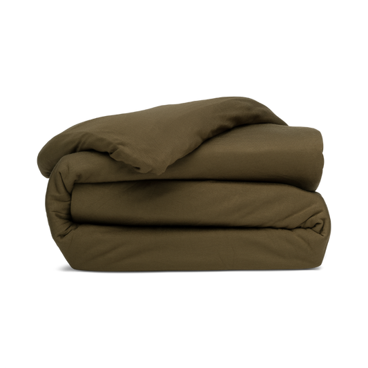 A folded duvet cover in forest green, with a zipper and corner ties visible.