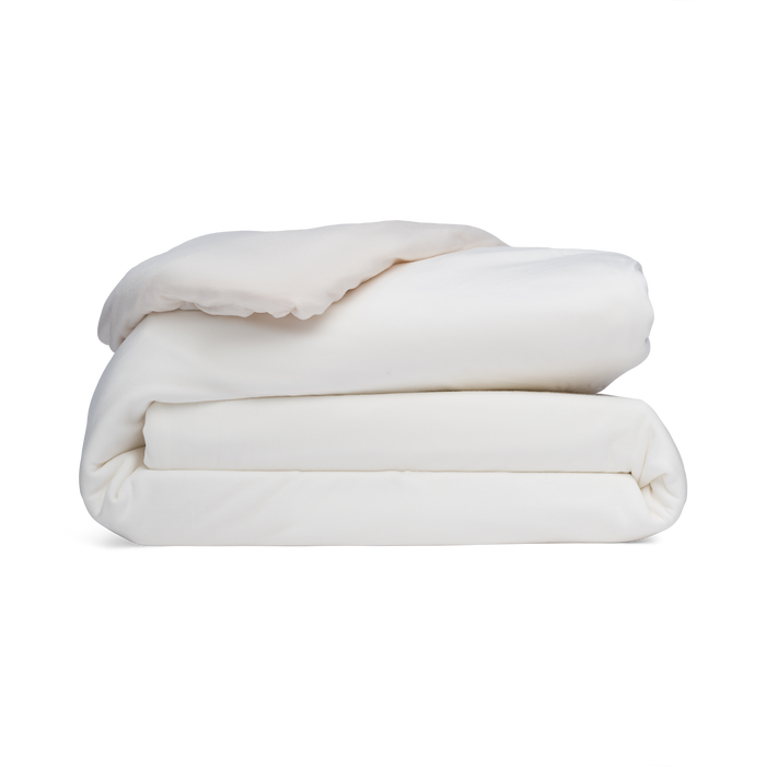 Stack of white blankets on a white background