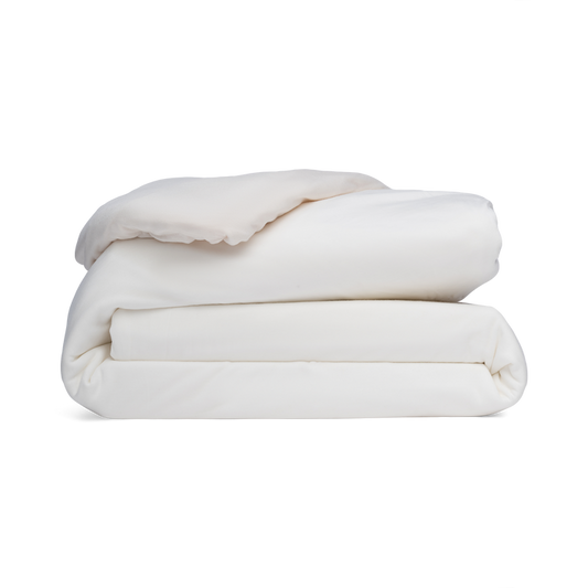 Stack of white blankets on a white background