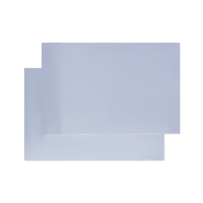 Two light blue pillowcases on top of each other flat laying image png