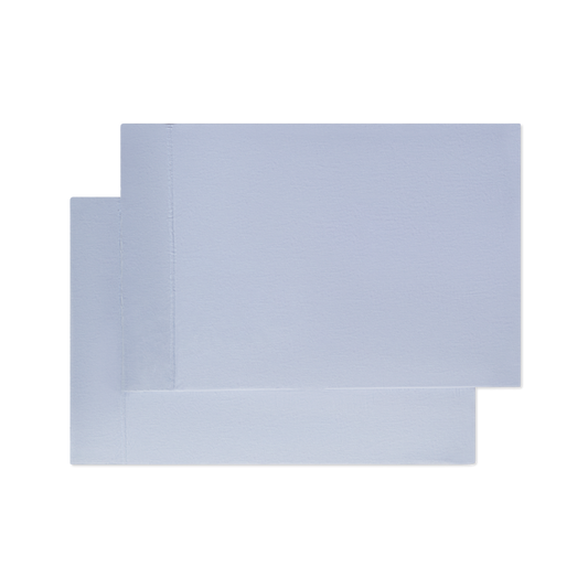 Two light blue pillowcases on top of each other flat laying image png