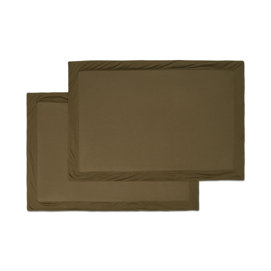 A set of forest green jersey knit sham pillowcases with a flange border flatlay image