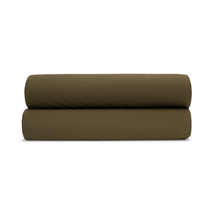 two green pillow shams folded on top of each other