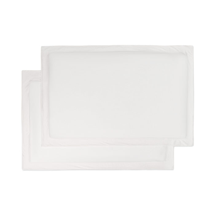 A set of flat lay white jersey knit sham pillowcases.