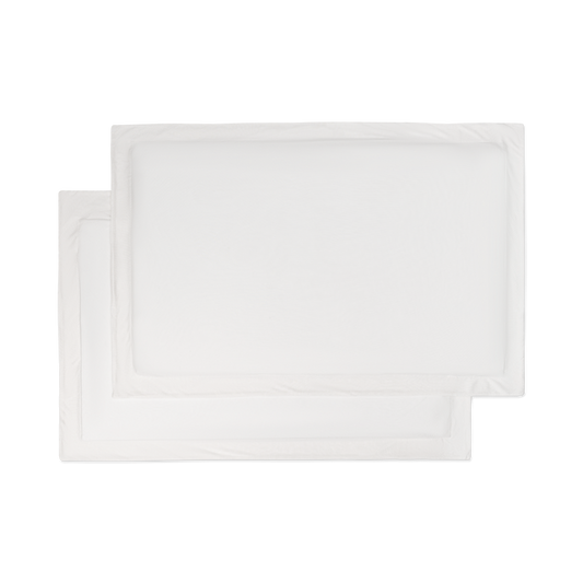 A set of flat lay white jersey knit sham pillowcases.