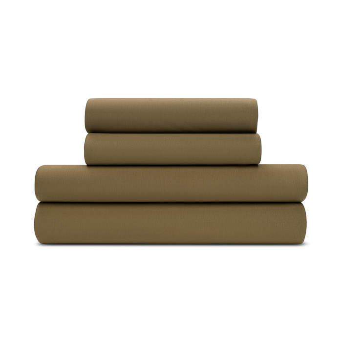 A folded forest green jersey knit sheet set on a plain background.