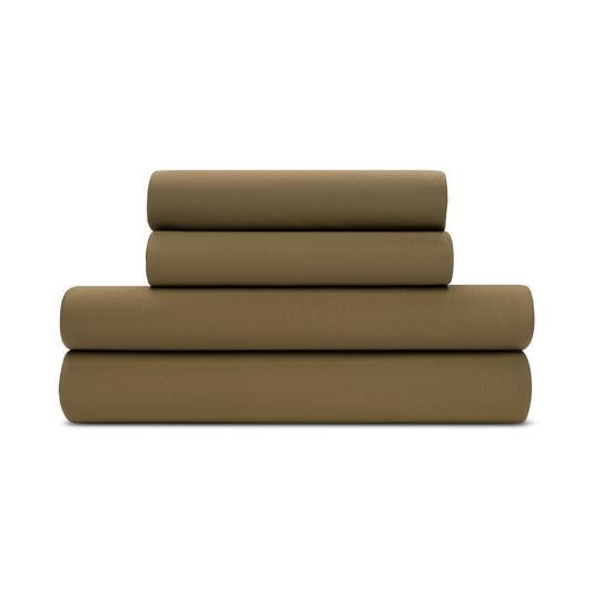 A folded forest green jersey knit sheet set on a plain background.