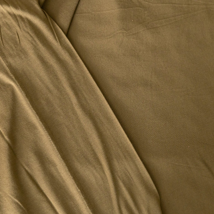 Close-up of forest green jersey knit fabric with visible texture