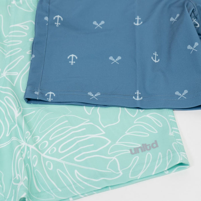 Mint Leaf Tactical 3.0 Youth Lacrosse Shorts underneath the tonal anchors shorts