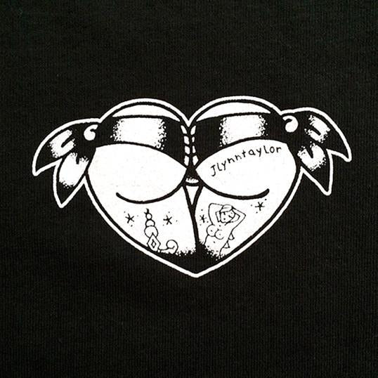 Tattoo style butt heart logo on black shirt.