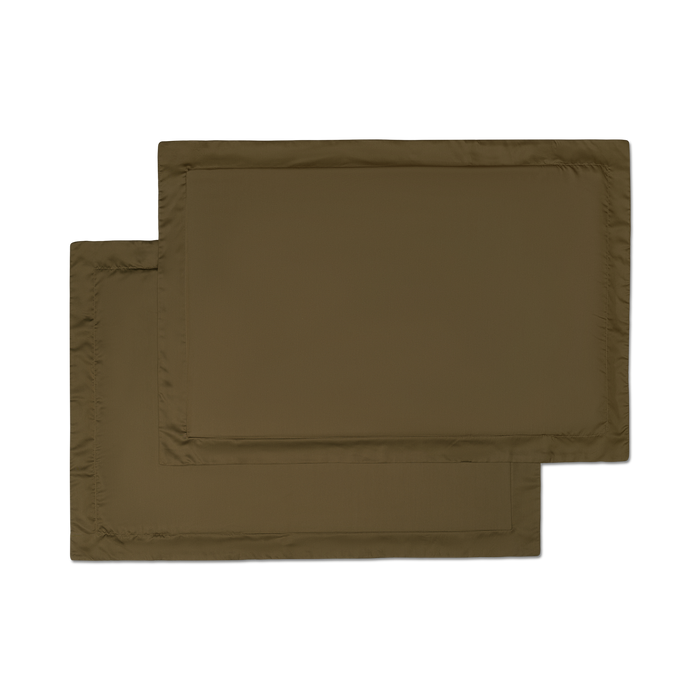 two sateen forest green pillowcase shams flat lay