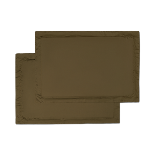 two sateen forest green pillowcase shams flat lay
