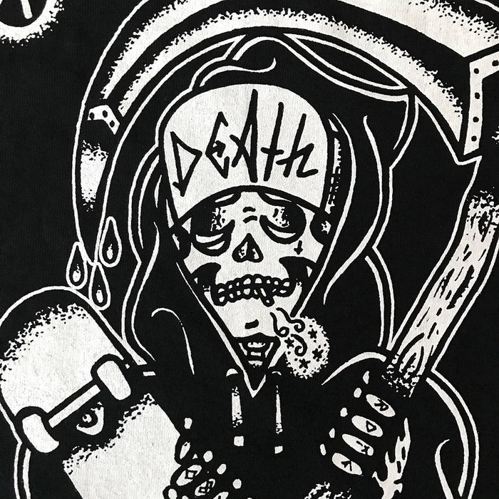 Close up of tattoo style skateboard reaper on black t-shirt.