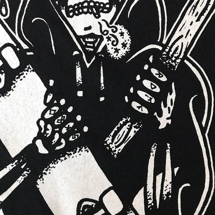 Close up of tattoo style skateboard reaper on black t-shirt.