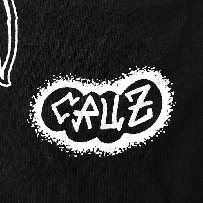 Close up of etters reading Cruz on black t-shirt.