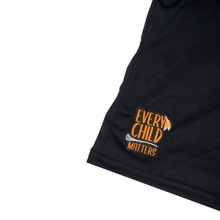 every child matters lacrosse short zoomed in on sewn logo