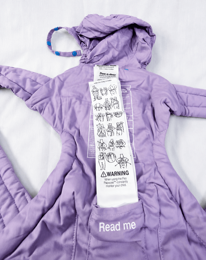 We Made Me Pao Papoose Three 3-in-1 Baby Carrier in Purple with multiple carrying positions, padded shoulder straps, adjustable waist belt, ergonomic support, and breathable fabric for comfortable babywearing.